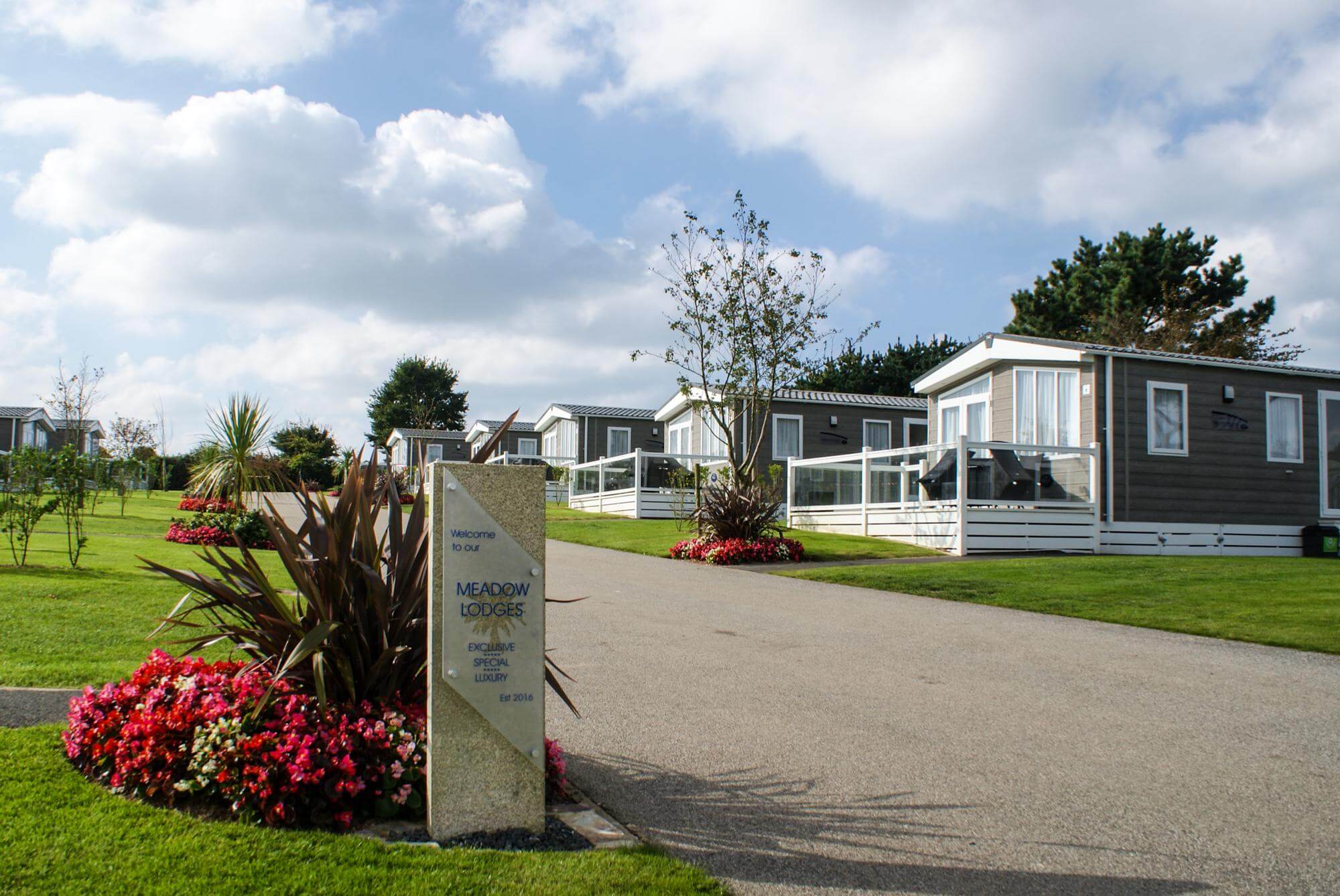 image of static caravans in a row on a sunny day