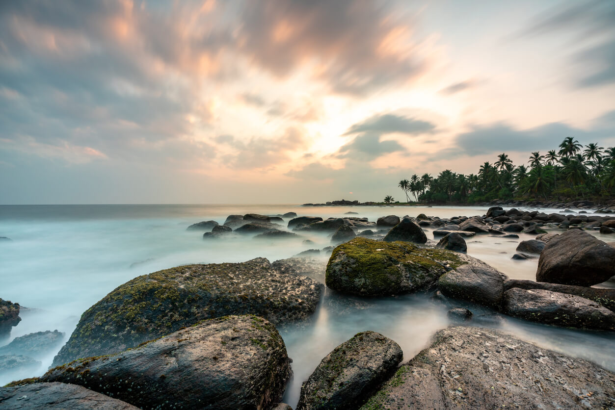 image of a rock pool on a tropical coastline at sunset