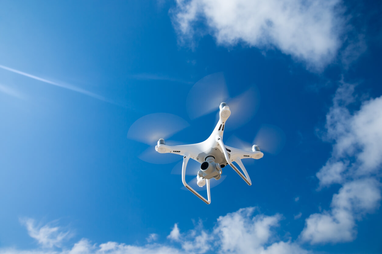 image of a drone below whilst capturing photography