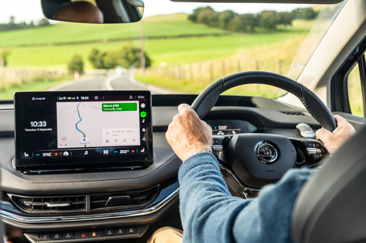 Man driving a motorhome with the satnav on