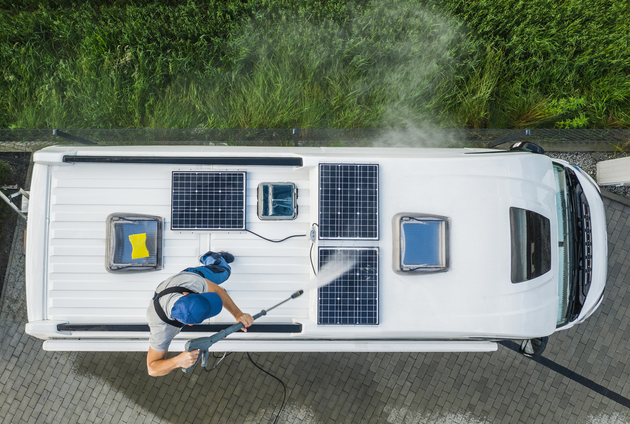 Man cleaning motorhome roof